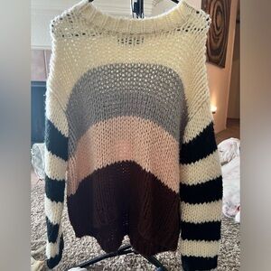 Cream/white with grey, light pink, and a maroon, with black on the sleeves